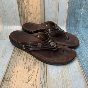 Brown Minnetonka low platform slip on sandals